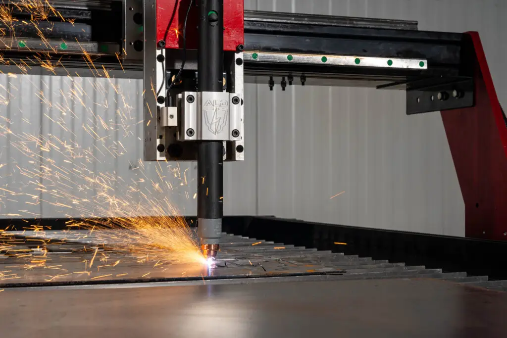 Arc Pro Ultra V3 plasma torch cutting a nested sheet of steel